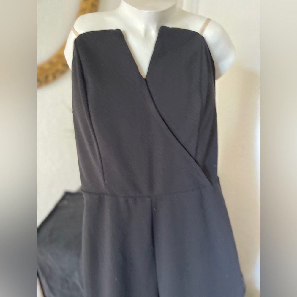 Black jumper with no straps the top tapered leg